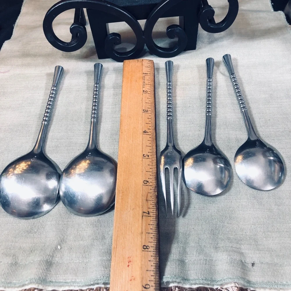 Set of Dansk Jette Stainless Steel flatware and / Four Stainless Steel Pegs